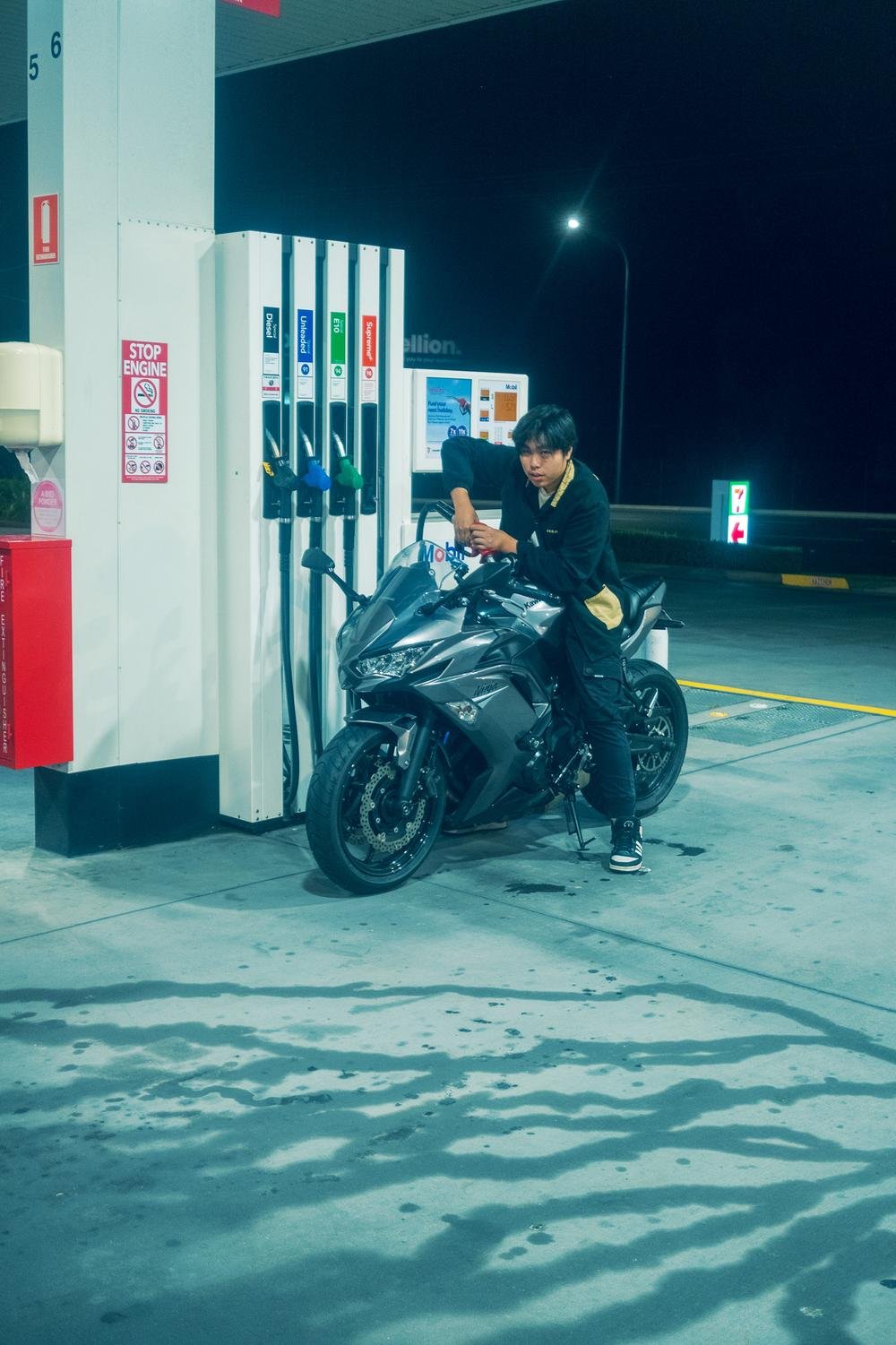 Motorcycle at gas station at night